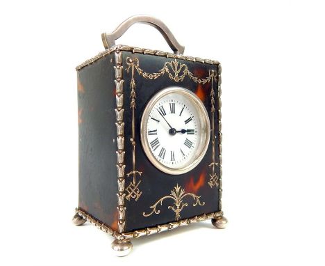 A George V silver and Tortoiseshell carriage clock by William Comyns, London 1910,   has Roman numerals and B set, within a s