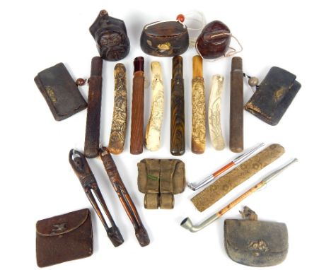 A collection of Japanese opium pipes, pipe holders and similar items, including a wooden jar with inlaid abalone leaves, havi