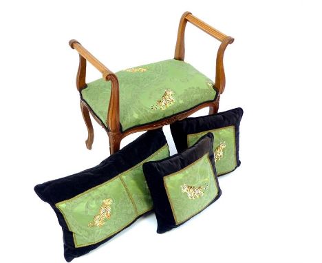 French early 20thC walnut dressing stool, twin arms, floral carving, cabriole legs, Tiger decorated silk upholstery & cushion