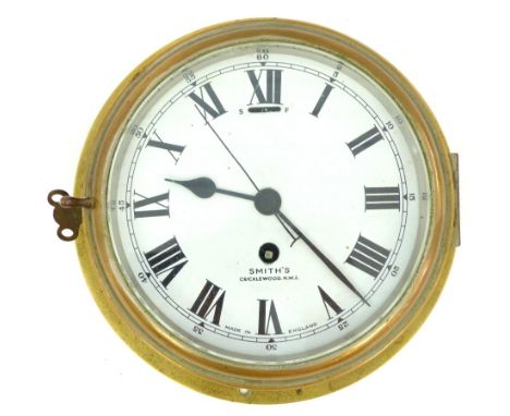 Ship's bulkhead clock c1900, Smith's of Cricklewood, brass case 6 1/2" enamel dial with Roman numerals, key winding 8 day sin