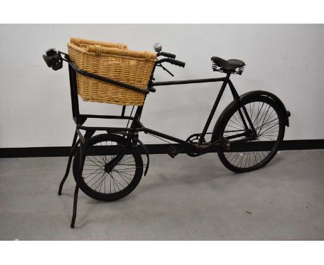 A 1960s-70s Delivery Boys Bicycle, standard design of small wheel to the front, larger to the back, complete with stand to th