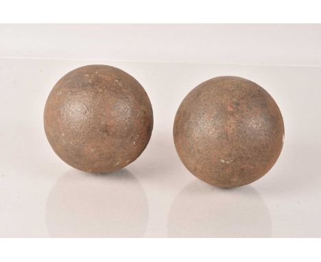 Two Vintage Cannon Balls, both having 9.5cm diameter, weighing 3.3kg each (2)