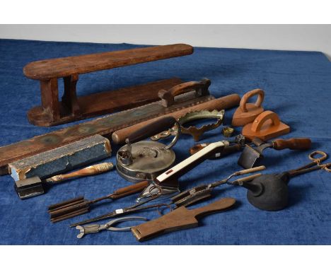 An assortment of Irons and Ironing Accessories, including a Round Iron, MacDonald's Rotary Hat Iron, Goffering Tongs, wooden 