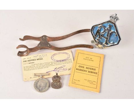 A WWII British Defence medal, awarded to Mr Fred Ford, believed to be a part of the Warden's Service, complete with silver AR