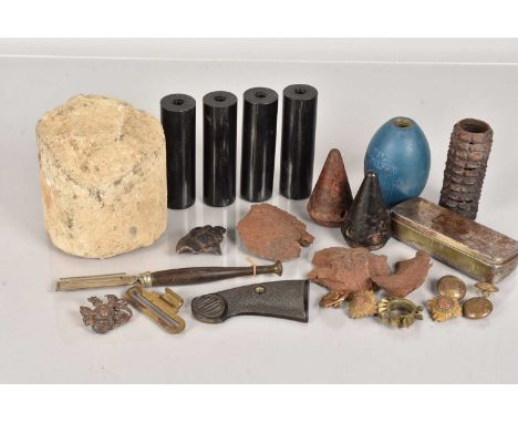 An assortment of various items, to include a practice grenade (L56A1), a WWII British Practice mine of a German S-Mine, a sma