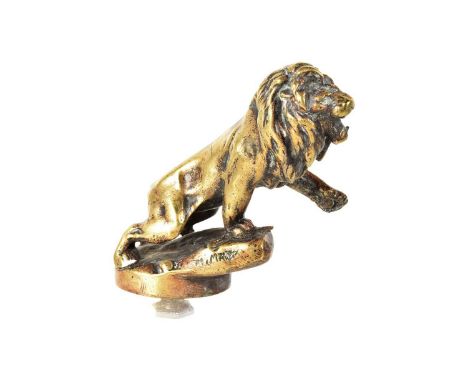 Morris Marx, a 1920s brass Peugeot Car Mascot, as a lion standing roaring on a rock, with signature 'M.Marx', 10.5cm H exclud