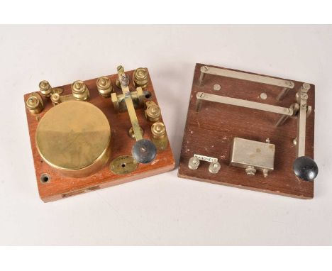 A WWI Morse Code Key by A.T.M Co Ltd, dated 1915, serial 3372, broad arrow marked, together with a later example, possibly WW