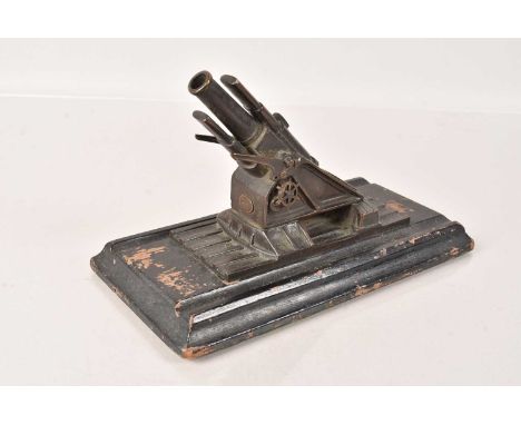 A desk model of a 15 Inch BL Howitzer, made by The Coventry Ordnance Works Ltd, England, having plaque to front and back, on 