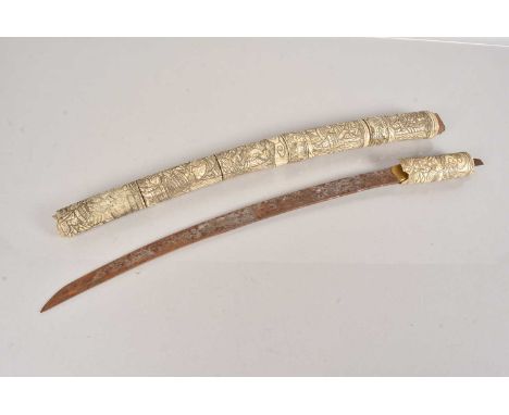A Japanese Wakasaki, having a 50cm curved blade, having sectional bone scabbard and grip, AF, having figural decoration, blad