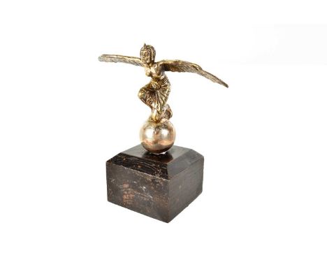 An Art Deco style Car Mascot, possibly the Egyptian Goddess 'Isis', the winged female figure kneeling on a globe, plated, on 