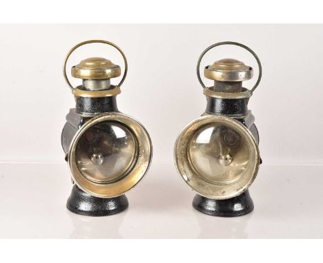 A pair of vintage Lucas Petroleum Motor-Lamps, having small plaques to the base with RD no.381175 &amp; 381176, both with sma