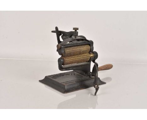 An American 'Crown' Fluting/Crimping Machine, having turned wooden handle, rectangular base inscribed 'PAT. NOV. 2. 1875. JUL