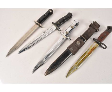 A Jungle Carbine No.5, complete with scabbard and frog, together with three SLR bayonets, comprising L1A4, L1A3 and Parade (4