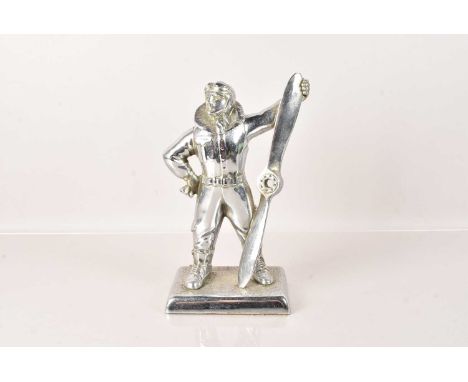 An RAF Pilot Table Lighter, chromed, in the form of a pilot holding a propeller, head hinged to the back, 27cm H