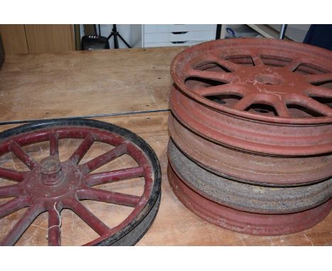 A Five Vintage Car wheels, four of a possible set, or four from a similar vehicle, one dated 1930, and one slightly different