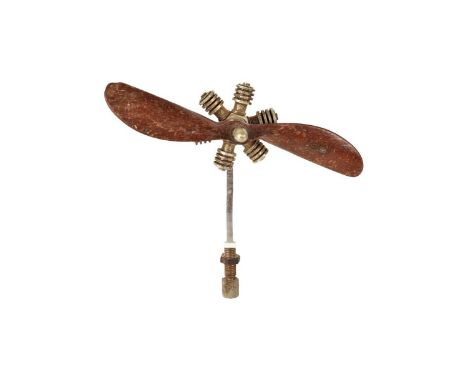 A Radial Engine Car Mascot, having rotating wooden 12.5cm propeller, on thin wire stand, 11cm H