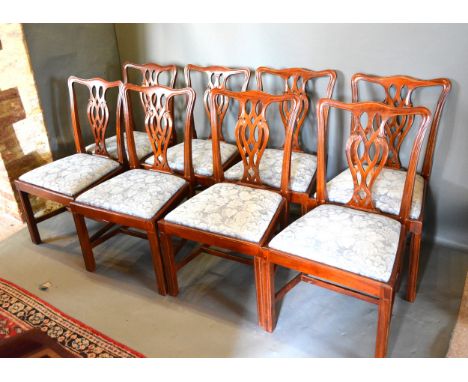 A Set Of Eight Mahogany Chippendale Style Dining Chairs each with a shaped pierced splat back above a drop in seat raised upo