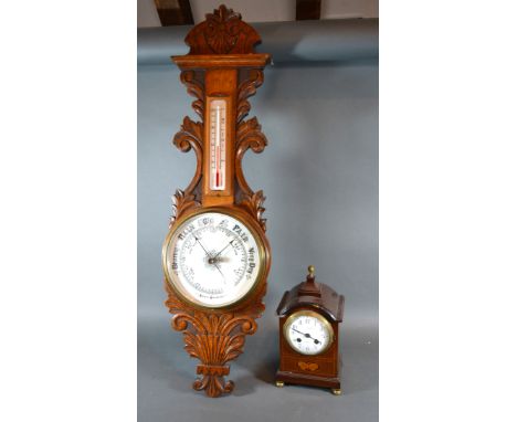 An Edwardian Mahogany Marquetry Inlaid Mantle Clock retailed by Mappin &amp; Webb Paris together with an oak barometer thermo