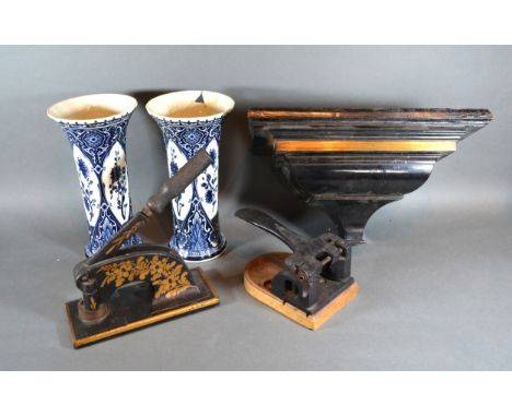 An Ebonised Clock Bracket together with two printing press and a pair of Delft vases 