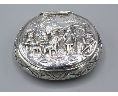 A Dutch White Metal Snuff Box decorated in relief with figures 8 x 9.5 cms 