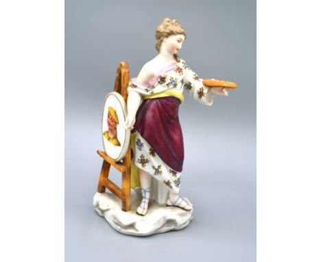 A Continental Figurine Of A Female With Artists Palette And Easel 23 cms tall 