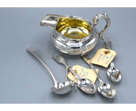 A William IV Silver Cream Jug, London 1831, together with three teaspoons and a silver ladle, 11 ozs. 