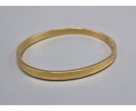 A 14ct gold bangle, 5.8 grams 