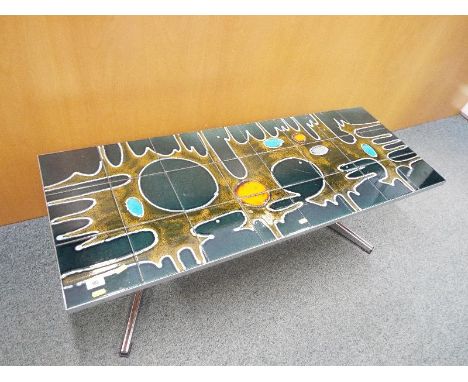 A retro chrome coffee table decorated with ceramic tiles in a burnt orange lava pattern 41 cm (h) x 123 cm (l) x 45 cm (d) - 