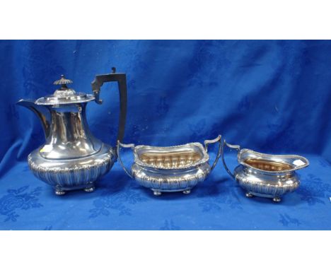 A SILVER-PLATED COFFEE POT a milk jug, and sucrier