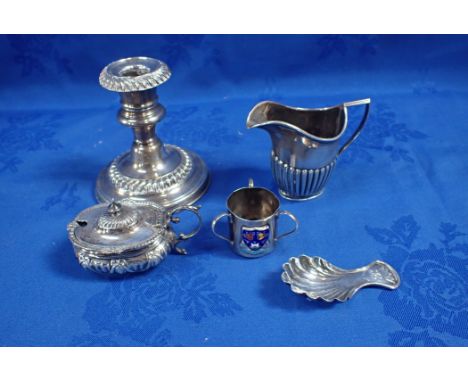 A SILVER FLUTED CREAM JUG together with a loaded silver candlestick, a silver caddy spoon and other silver items