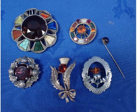 FIVE SCOTTISH BROOCHES SET WITH STONES with a stick pin