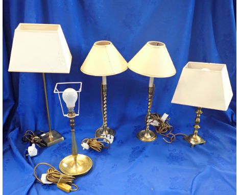 A PAIR OF SPIRAL-STEM BRASS CANDLESTICK LAMPS and three similar brass table lamps (5)