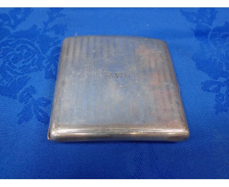 A CURVED SILVER CIGARETTE CASE with engine turned decoration (with initials)