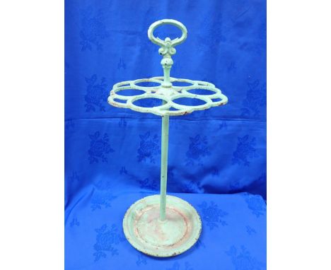 A CAST-IRON STICK STAND the top with six circular apertures (some cracks), and a carrying handle, probably French, painted gr