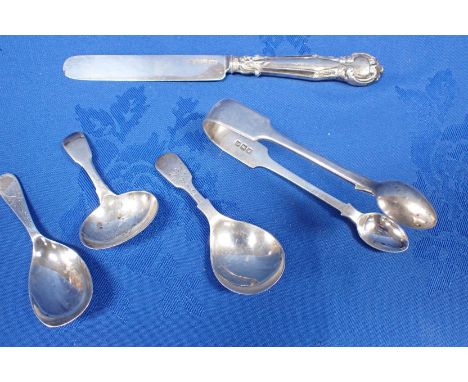 A SILVER BUTTER KNIFE BY GEORGE UNITE three silver caddy spoons, and a pair of sugar tongs