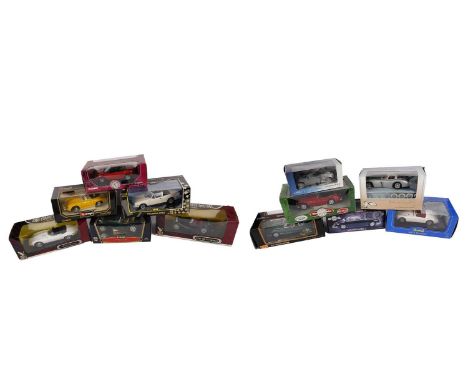 A collection of diecast model cars, primarily scale 1:18, all in their boxes, including: a Model Icons 'Jaguar Mk2'; a Bburag