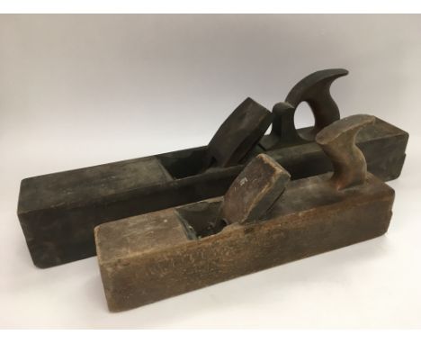A box of old tools and two wood planes.