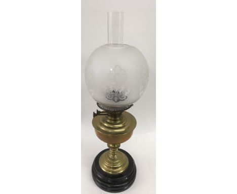 A brass oil lamp with glass shade, approx 60cm