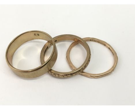 Three 9ct gold wedding bands.Approx P-R, 8.6g