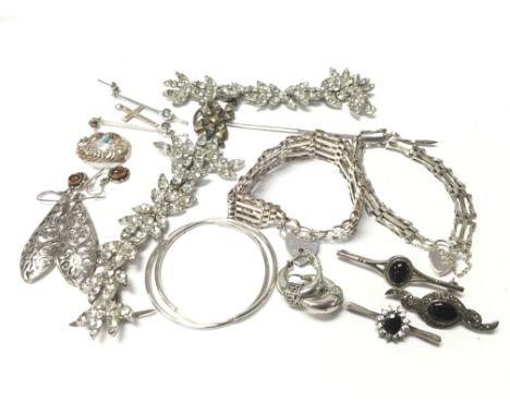 Two silver gate bracelets, silver bar brooches and other jewellery items.