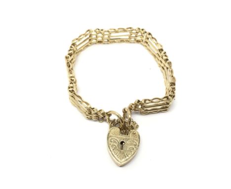 A 9ct gold four bar gate bracelet with heart shaped padlock clasp, weight approx 19.4 grams.