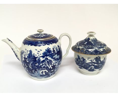 An 19th Century Worcester Blue and white tea pot with a conforming sugar bowl and cover marks in underglaze blue to the base.