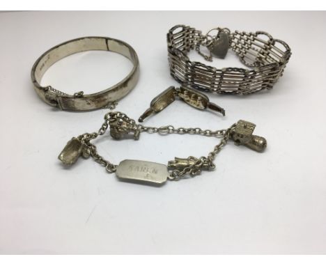 A group of silver jewellery to include a bangle, gate bracelet and a charm bracelet with the name Karen, including an interes