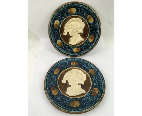 A pair of continental majolica  pottery portrait plates