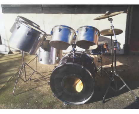 A Tama drumkit comprising bass drum, snare, floor tom, four rack toms, cymbals, hardware and accessories.