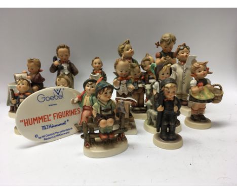 A collection of 15 goebel Hummel figures