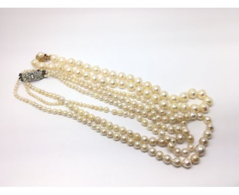 A graduating multi strand cultured pearl necklace and a second cultured pearl necklace.