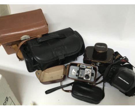 A box containing cameras and equipment including a eumig Minolta and Pentax
