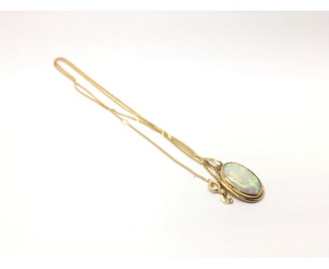 A 9ct gold opal oval pendant on a 9ct gold chain, total weight approx 4.3 grams.