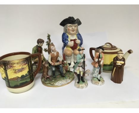 A collection of ceramics Including a Royal Worcester figure of a monk a 19th century Staffordshire caricature jug Doulton and